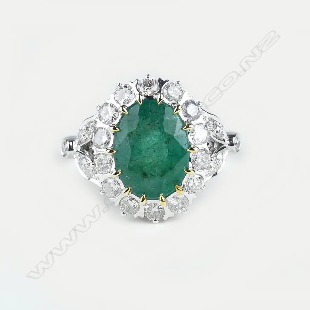 A 14ct gold emerald and diamond ring Image 1++