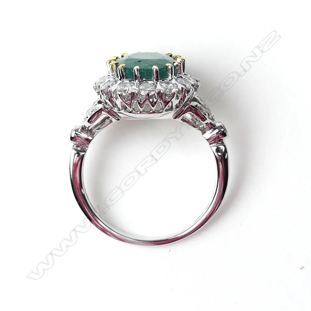 A 14ct gold emerald and diamond ring Image 1++