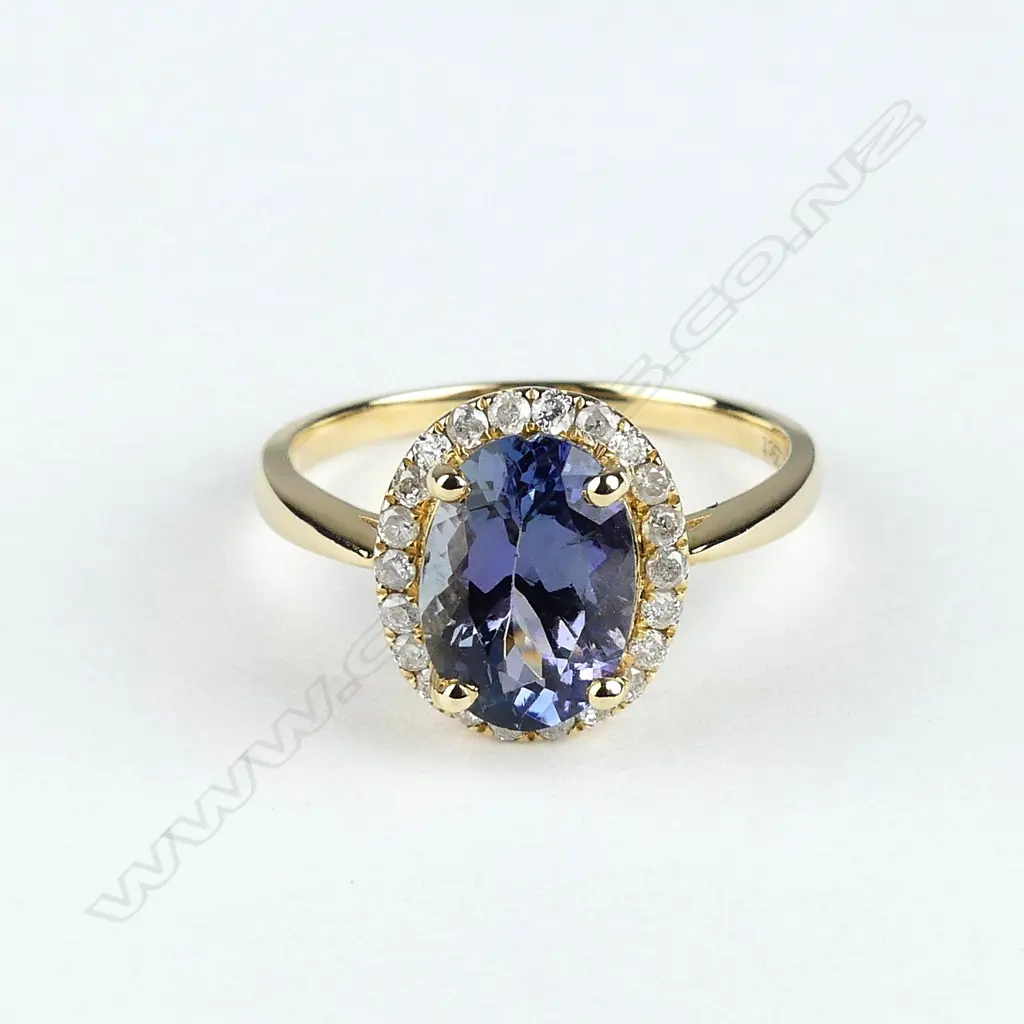 A 14ct gold tanzanite and diamond ring Image 1++
