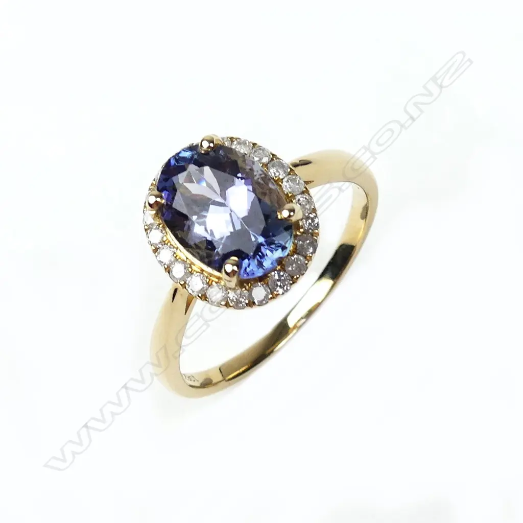 A 14ct gold tanzanite and diamond ring Image 1++