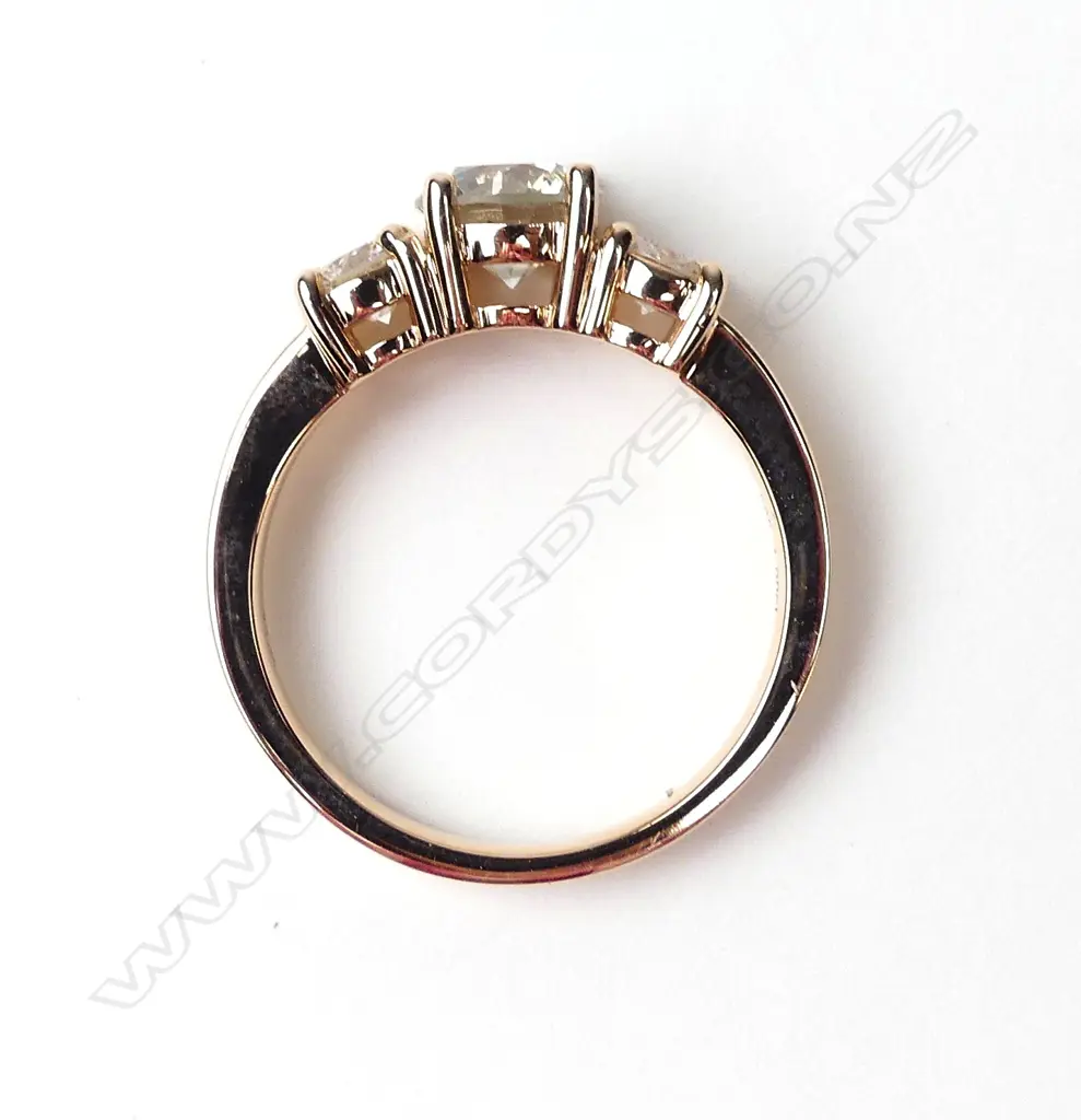 A 14ct rose gold and diamond trilogy ring Image 1++