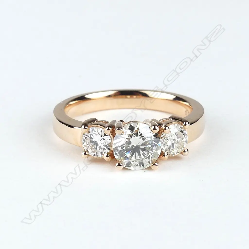 A 14ct rose gold and diamond trilogy ring Image 1++