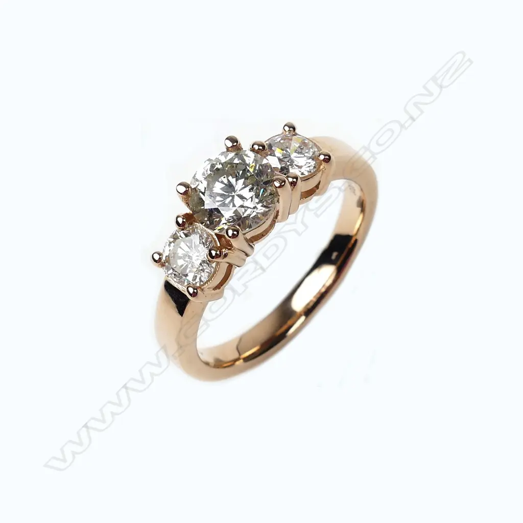 A 14ct rose gold and diamond trilogy ring Image 1++
