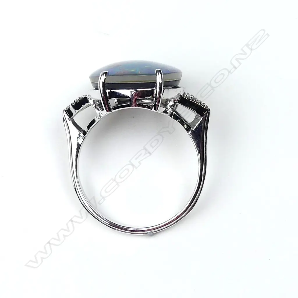 A 9ct white gold opal and diamond ring Image 1++