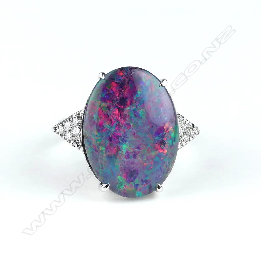 A 9ct white gold opal and diamond ring Image 1++