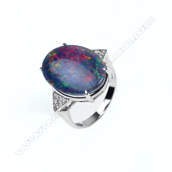 A 9ct white gold opal and diamond ring