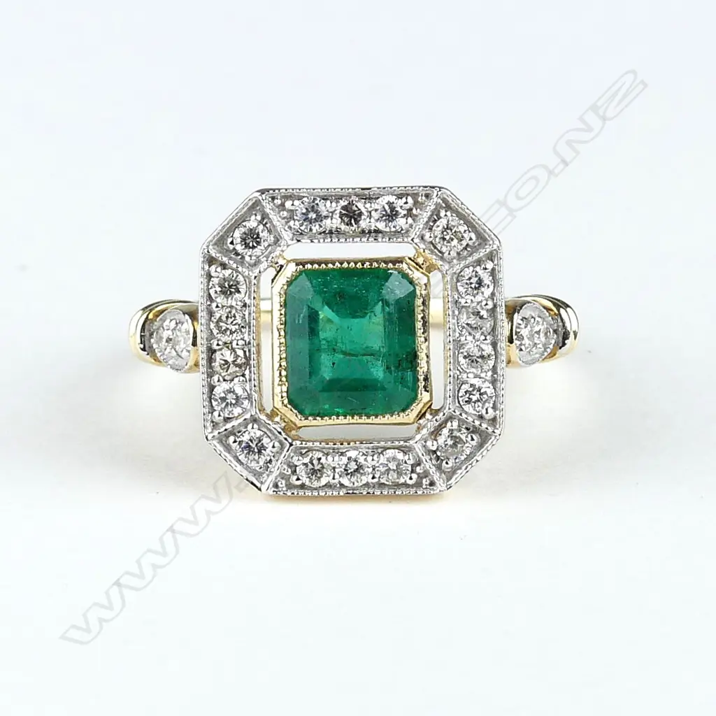 A 9ct gold emerald and diamond ring Image 1++