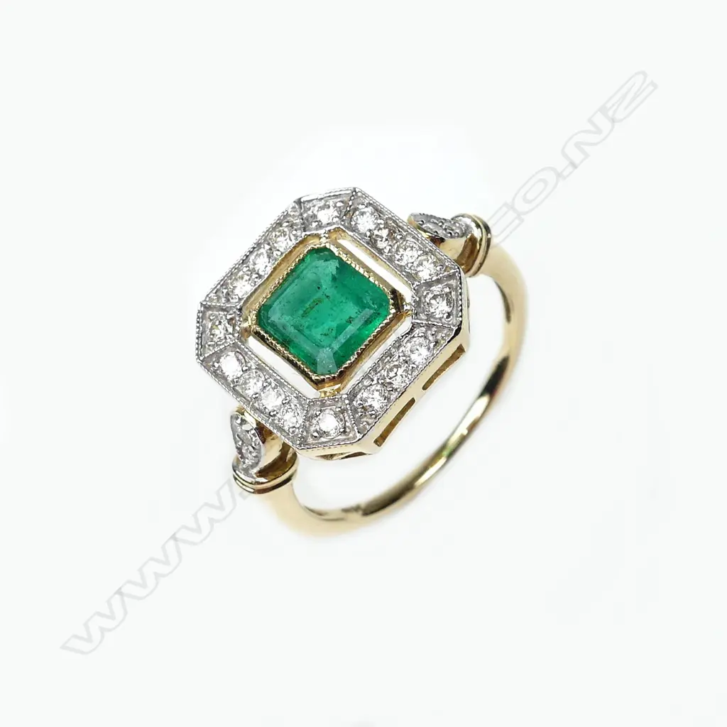 A 9ct gold emerald and diamond ring Image 1++