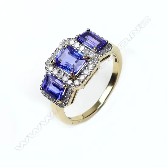 A 9ct gold tanzanite and diamond trilogy ring