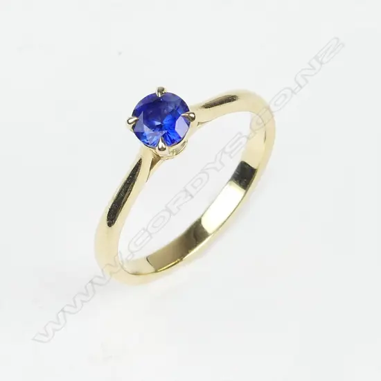 An 18ct gold and sapphire solitaire ring