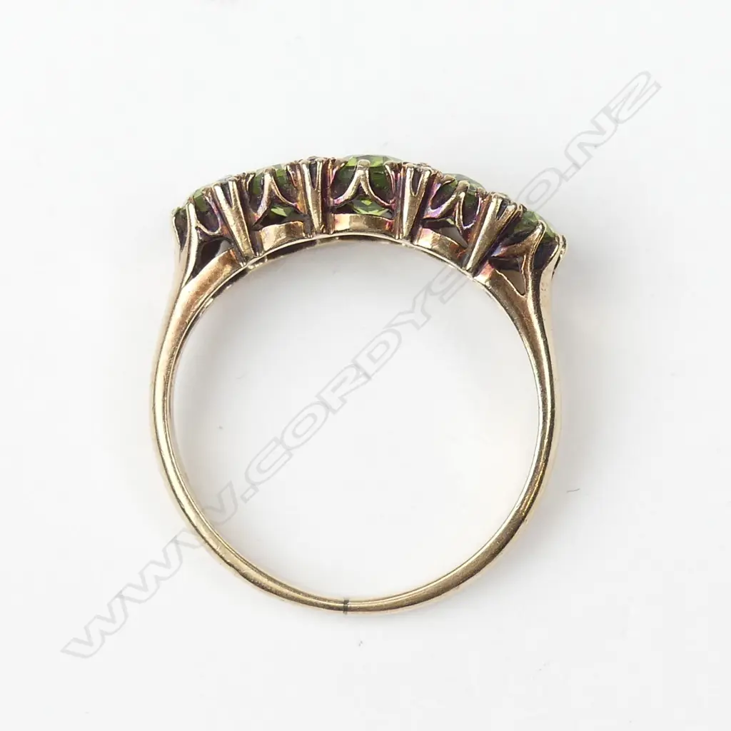 A 9ct gold peridot and diamond ring Image 1++