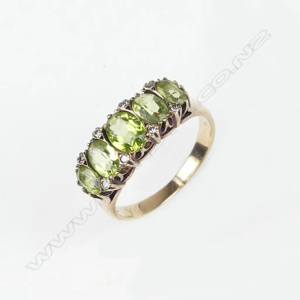 A 9ct gold peridot and diamond ring Image 1++