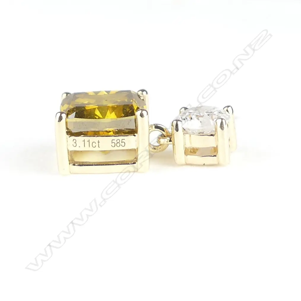 A pair of 14ct gold and diamond stud earrings Image 1++