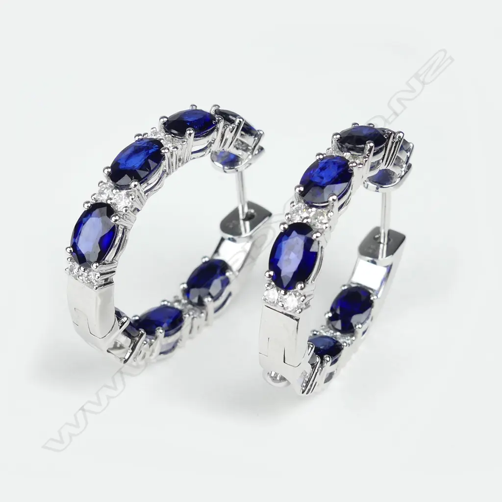 A pair of 14ct white gold sapphire and diamond hoop earrings Image 1++