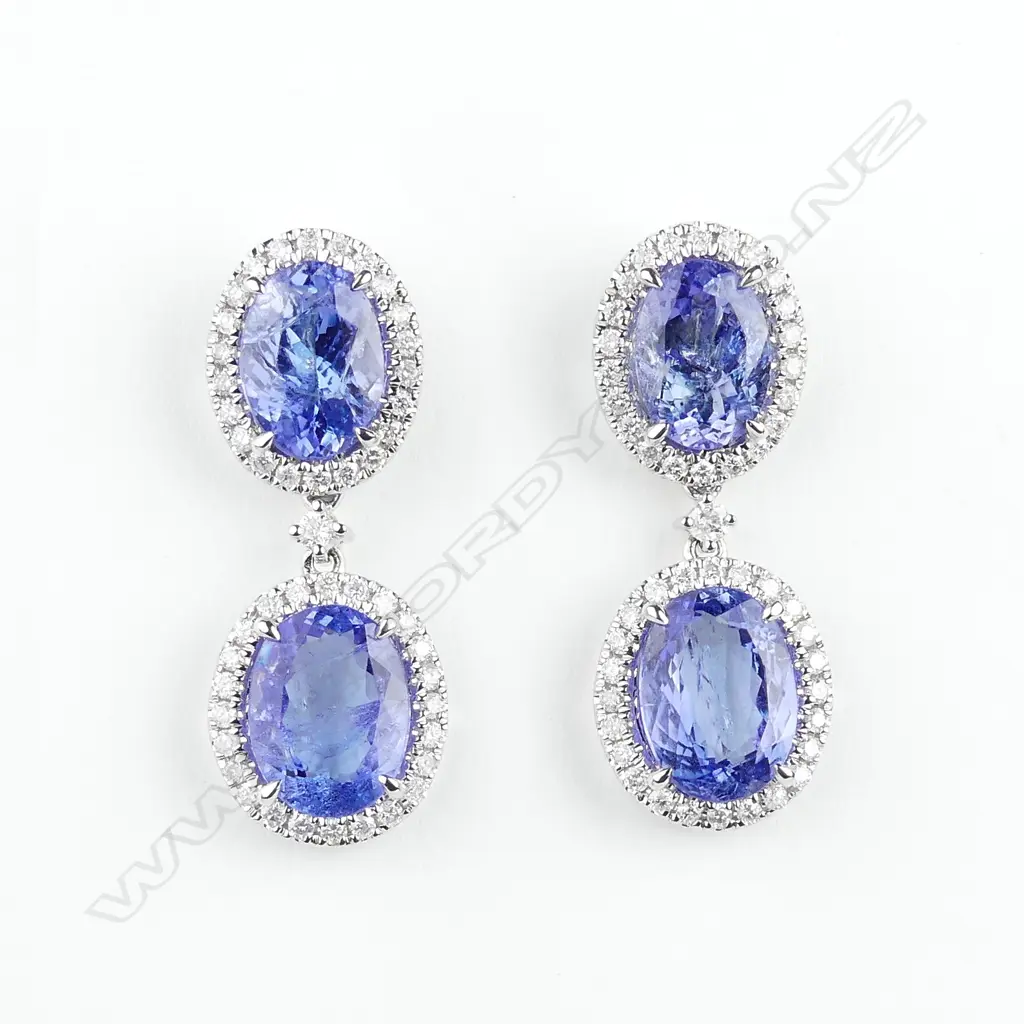 A pair of 14ct white gold tanzanite and diamond drop earrings Image 1++