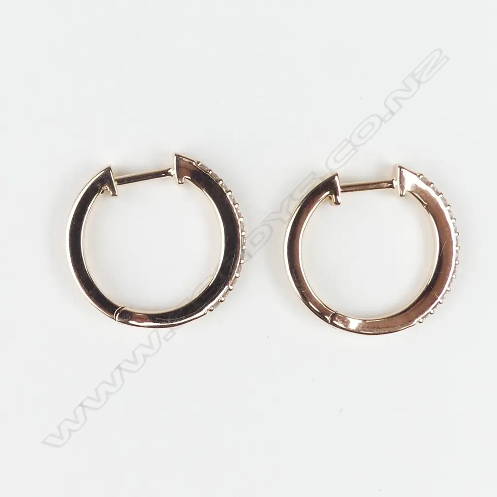 A pair of 18ct rose gold and diamond 'huggie' on-the ear hoop earrings Image 1++