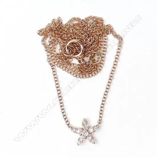 An 18ct rose gold and diamond pendant