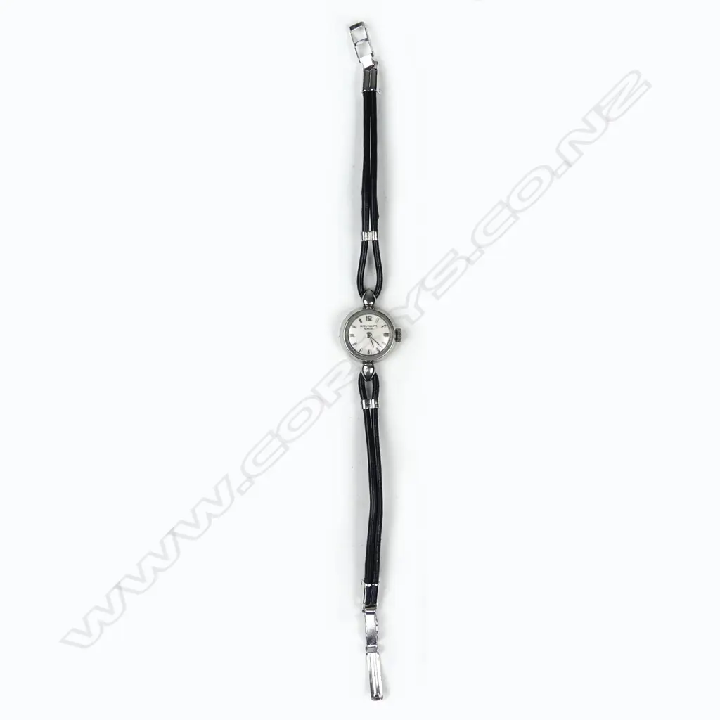 A Patek Philippe lady's vintage platinum wristwatch Image 1++