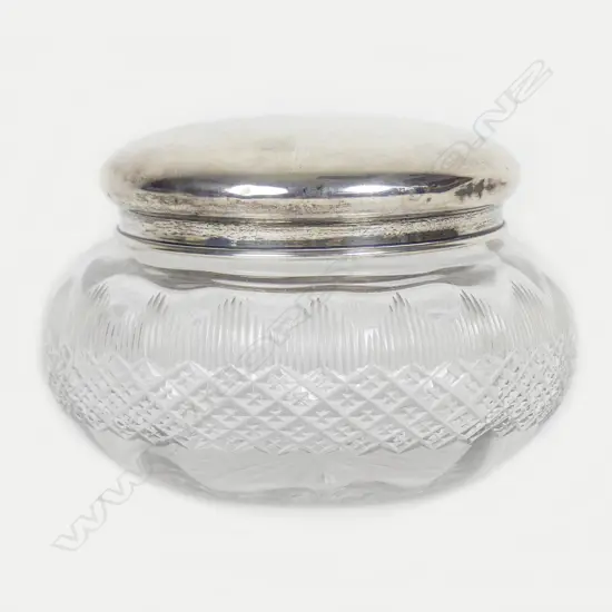 A silver lidded cut glass powder bowl