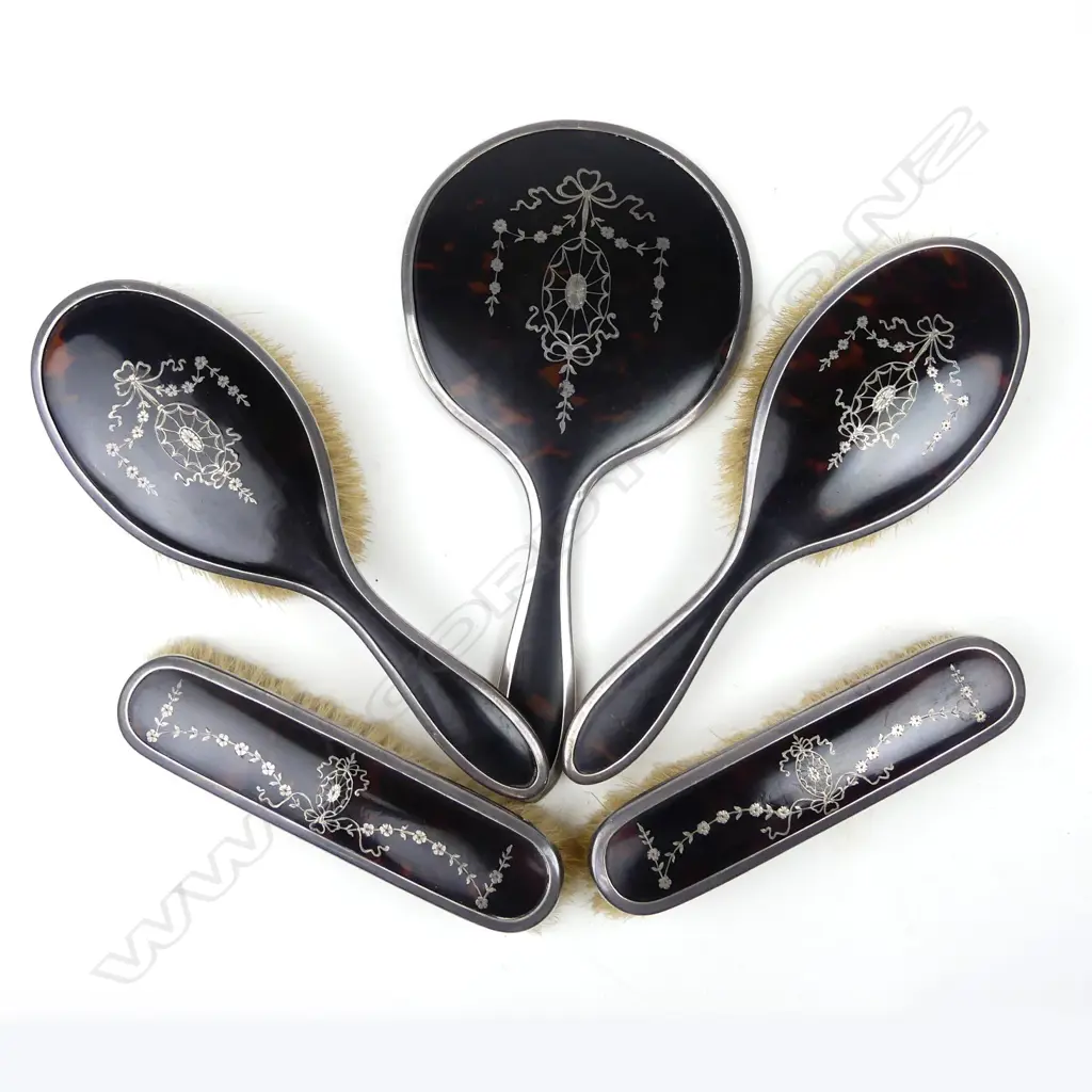 A silver and tortoiseshell pique work dressing table set Image 1++