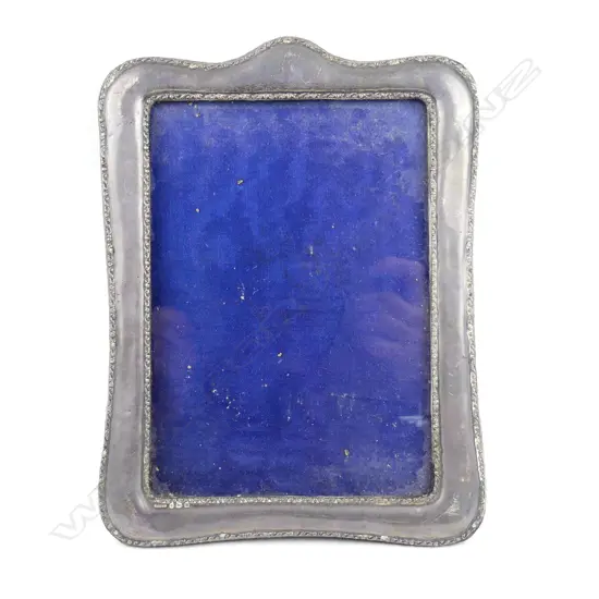 An Edwardian silver photo frame