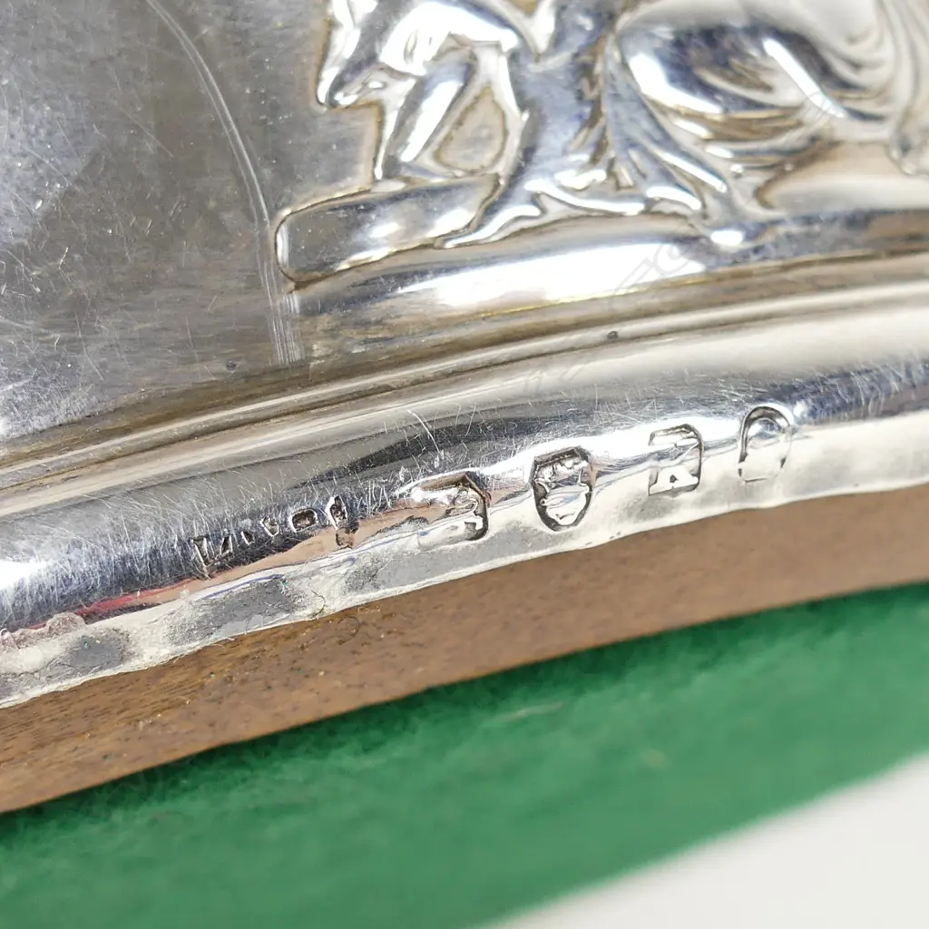 An uncommon George III silver decorated bottle coaster Image 1++