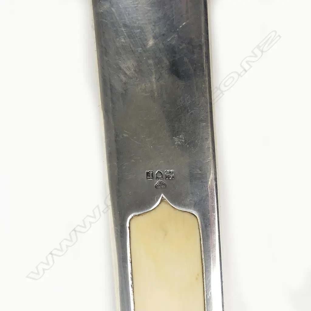 An early 20thC silver handled long ivory paper knife Image 1++