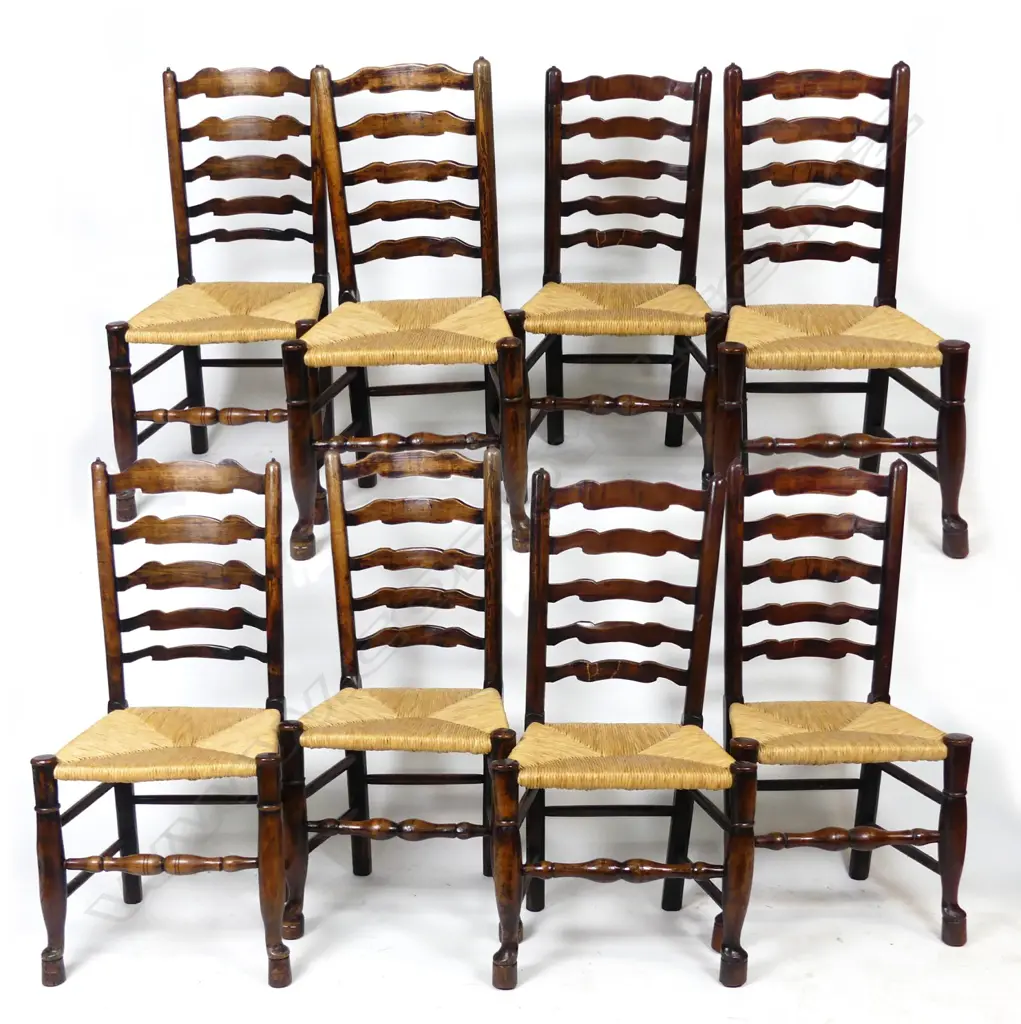 A set of eight oak ladder back chairs Image 1++