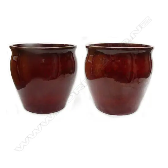 A pair of large red flambé glazed garden pots