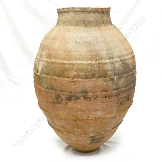 An old Turkish terracotta tall storage jar