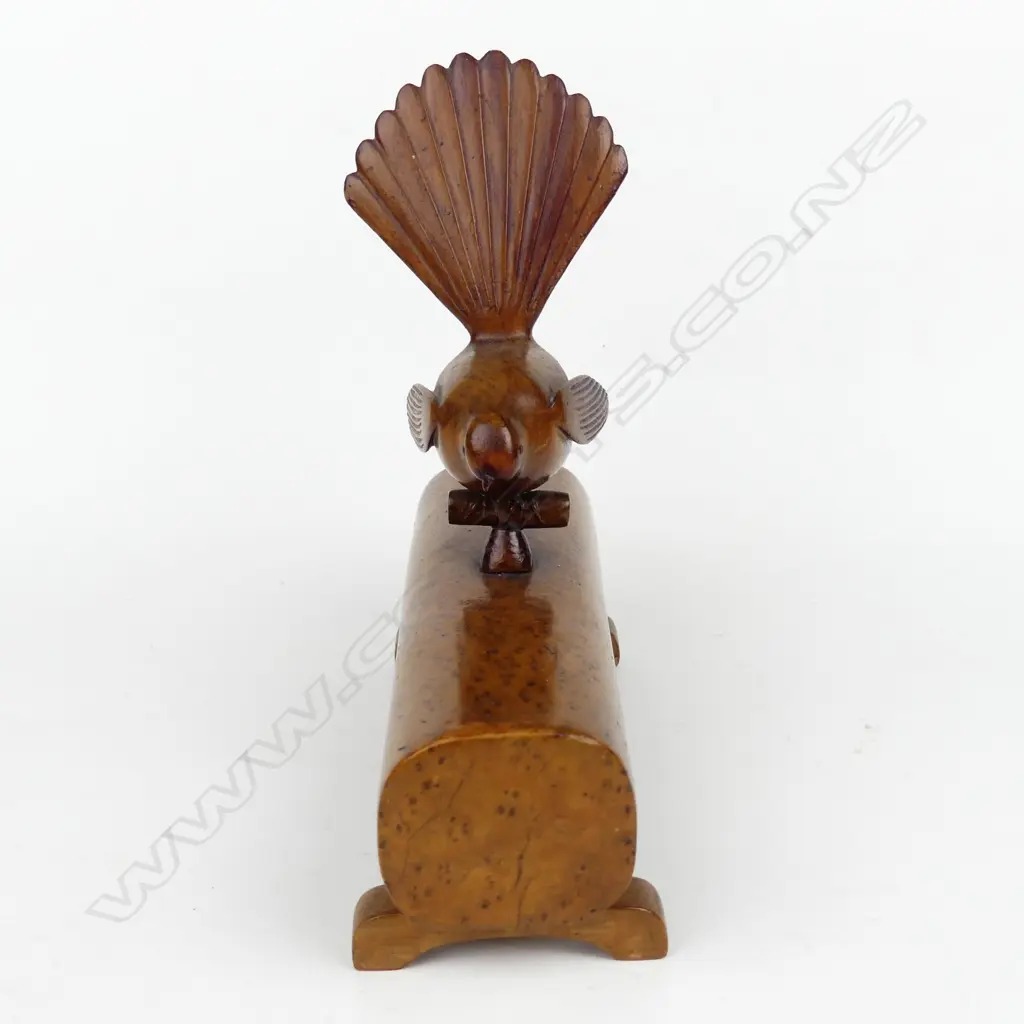 A native timber folk art carving of a fantail on a log Image 1++