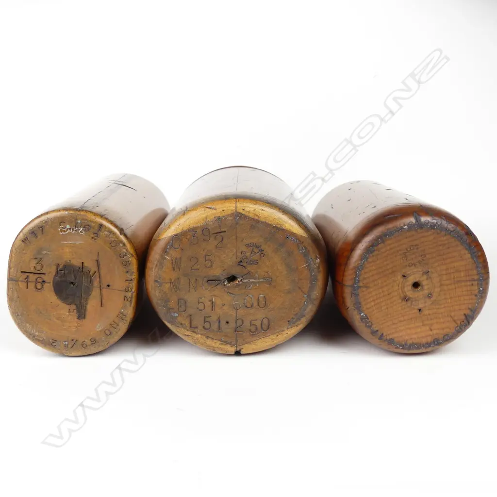 Three early 20thC turned kauri foundry moulds for spirit bottles Image 1++