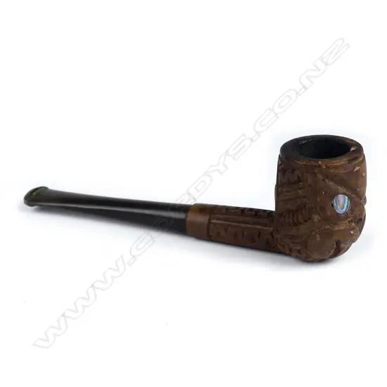 A vintage Maori carved pipe