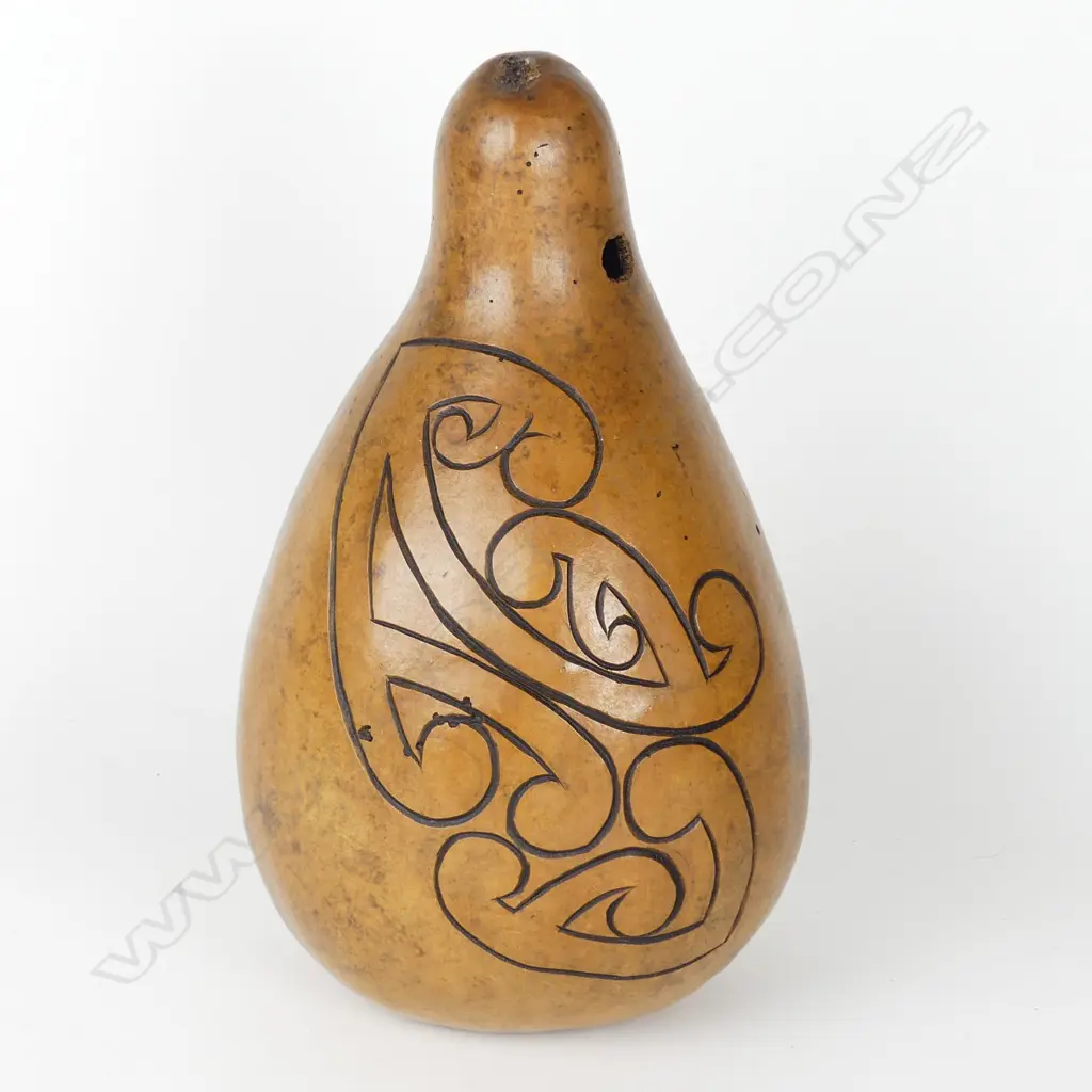 A large gourd carved with Maori kowhaiwhai inspired designs Image 1++