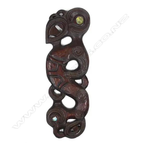 A 1970s Maori carved wall plaque by Norm Clark (1942-2016)