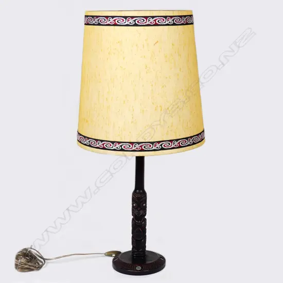 A resin cast Maori design table lamp base with kowhaiwhai pattern shade