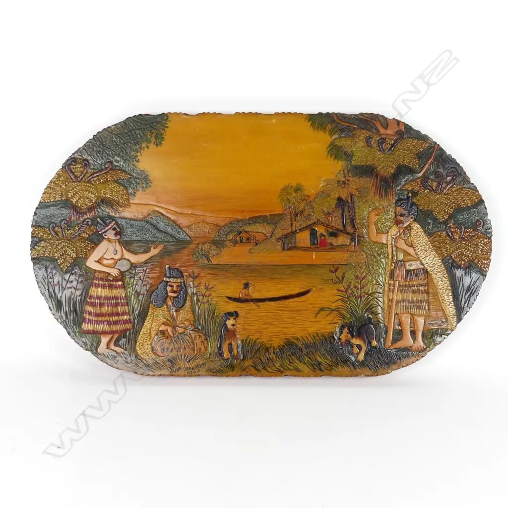 An oval Jane Brenkley carved and painted Maori themed table-top/wall plaque Image 1++