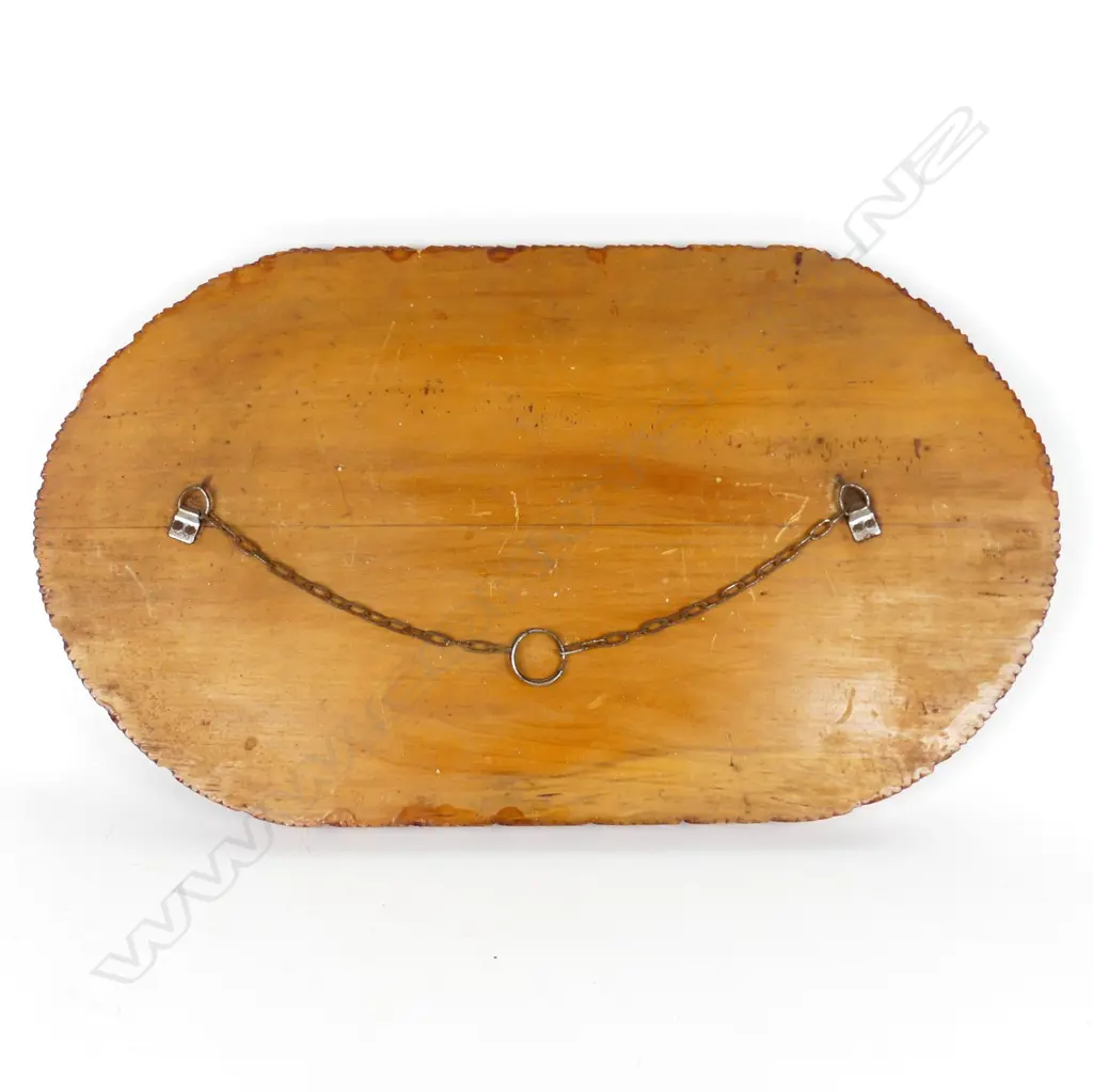 An oval Jane Brenkley carved and painted Maori themed table-top/wall plaque Image 1++