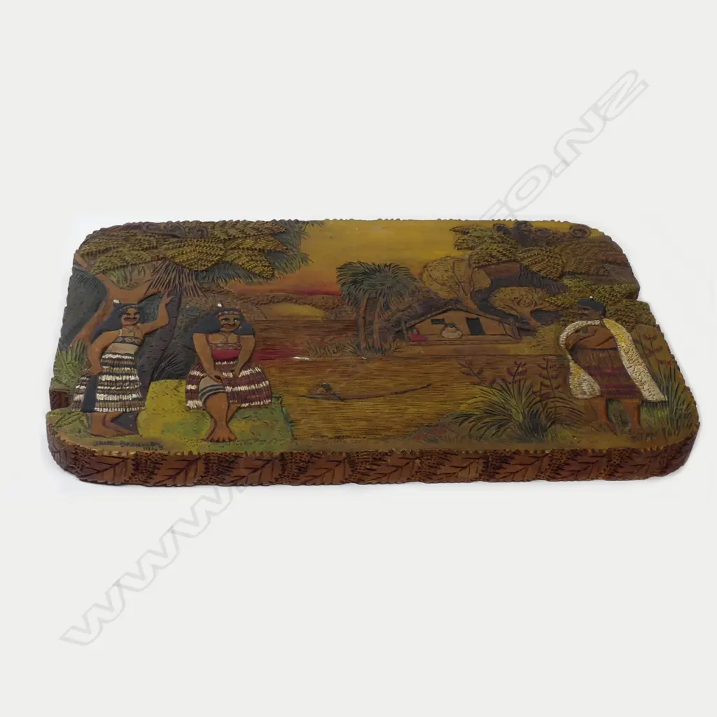 An oblong Jane Brenkley carved and painted Maori themed table top/wall plaque Image 1++