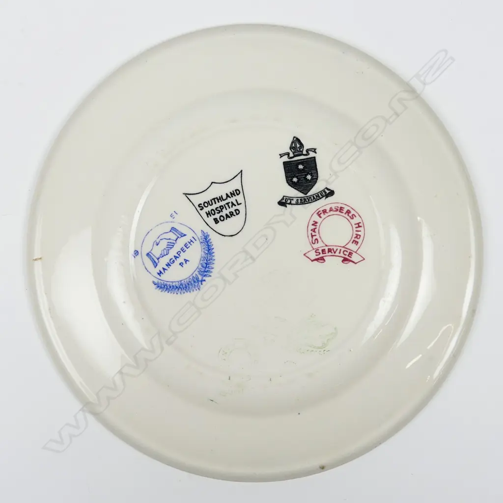 A Crown Lynn (unmarked) circular plate decorated with various hotel Image 1++