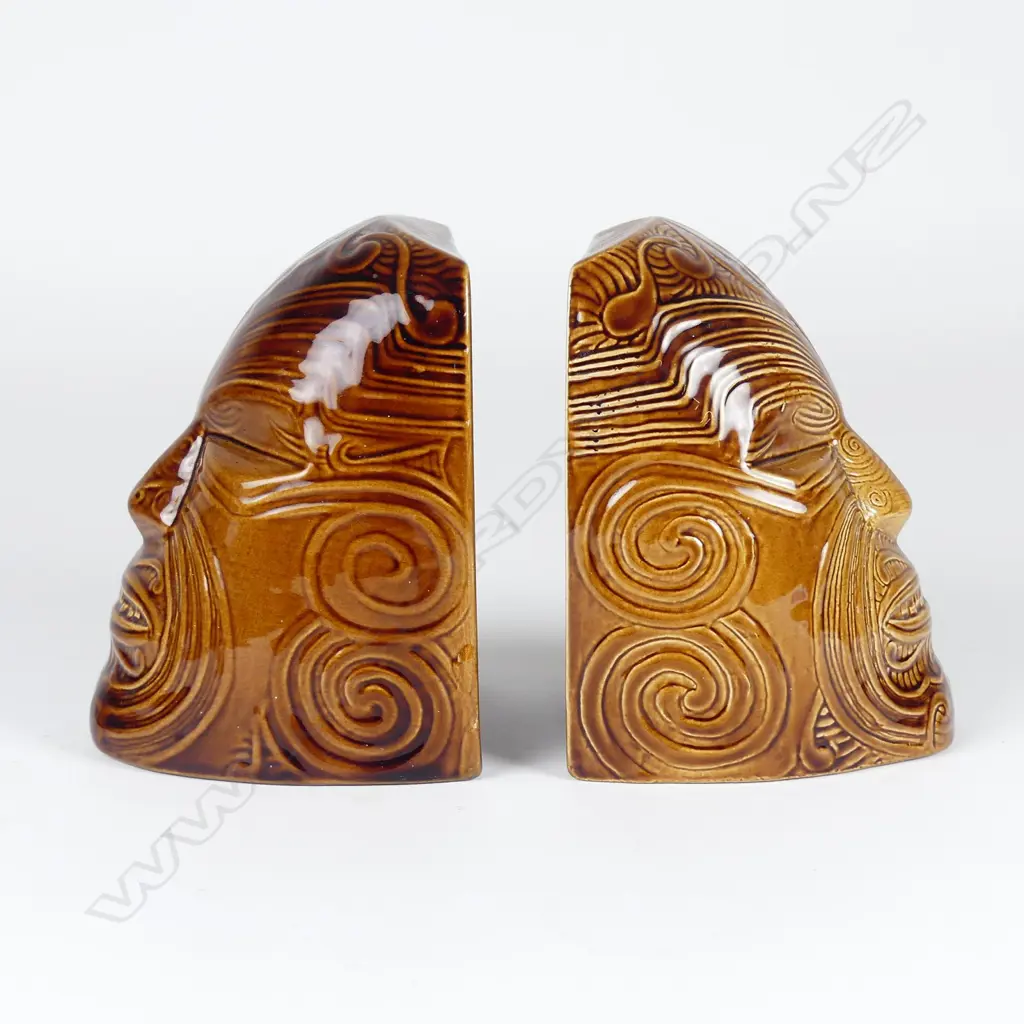 A pair of Crown Lynn Wharetana ware 'Moko' bookends Image 1++