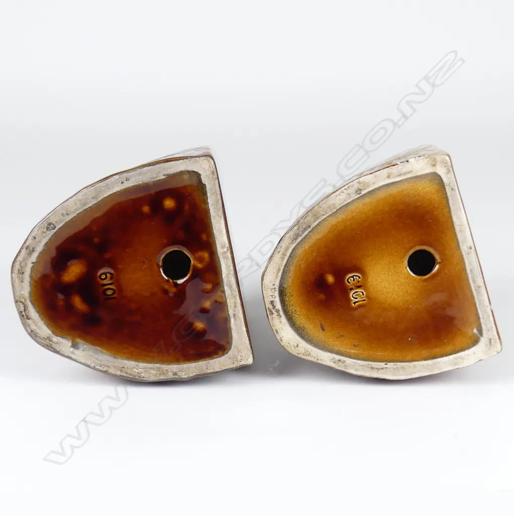 A pair of Crown Lynn Wharetana ware 'Moko' bookends Image 1++