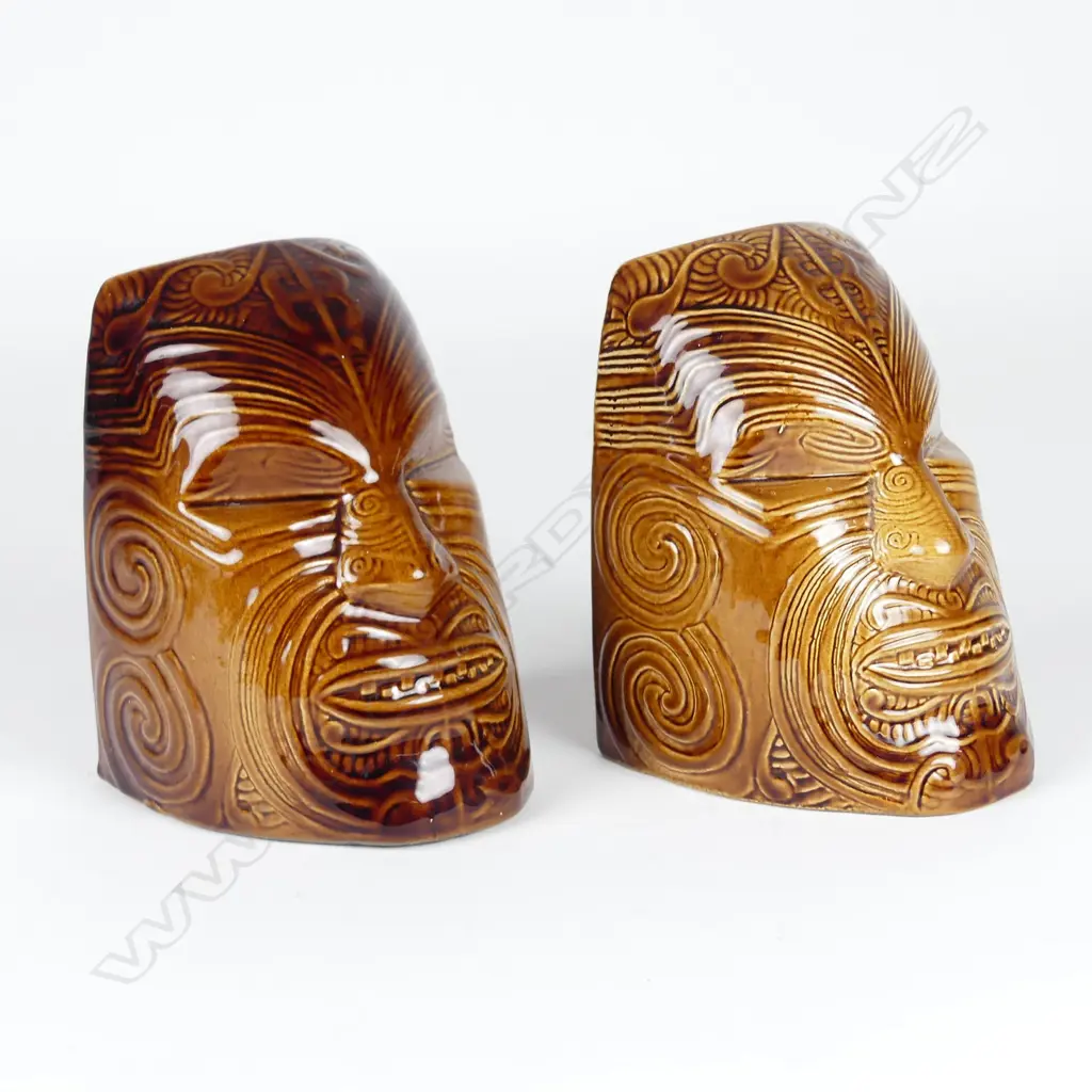 A pair of Crown Lynn Wharetana ware 'Moko' bookends Image 1++