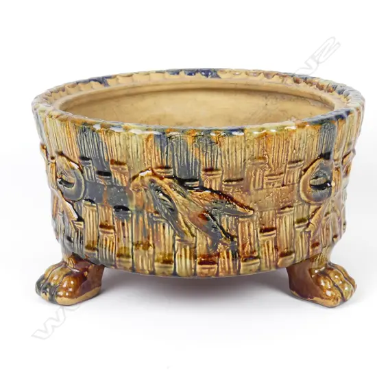 A majolica glazed planter base attributed to Peter Hutson & Co.