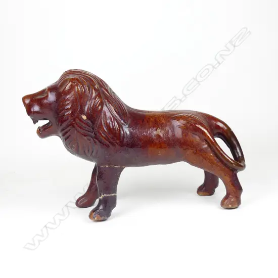 An unusual large Victorian pottery lion money bank