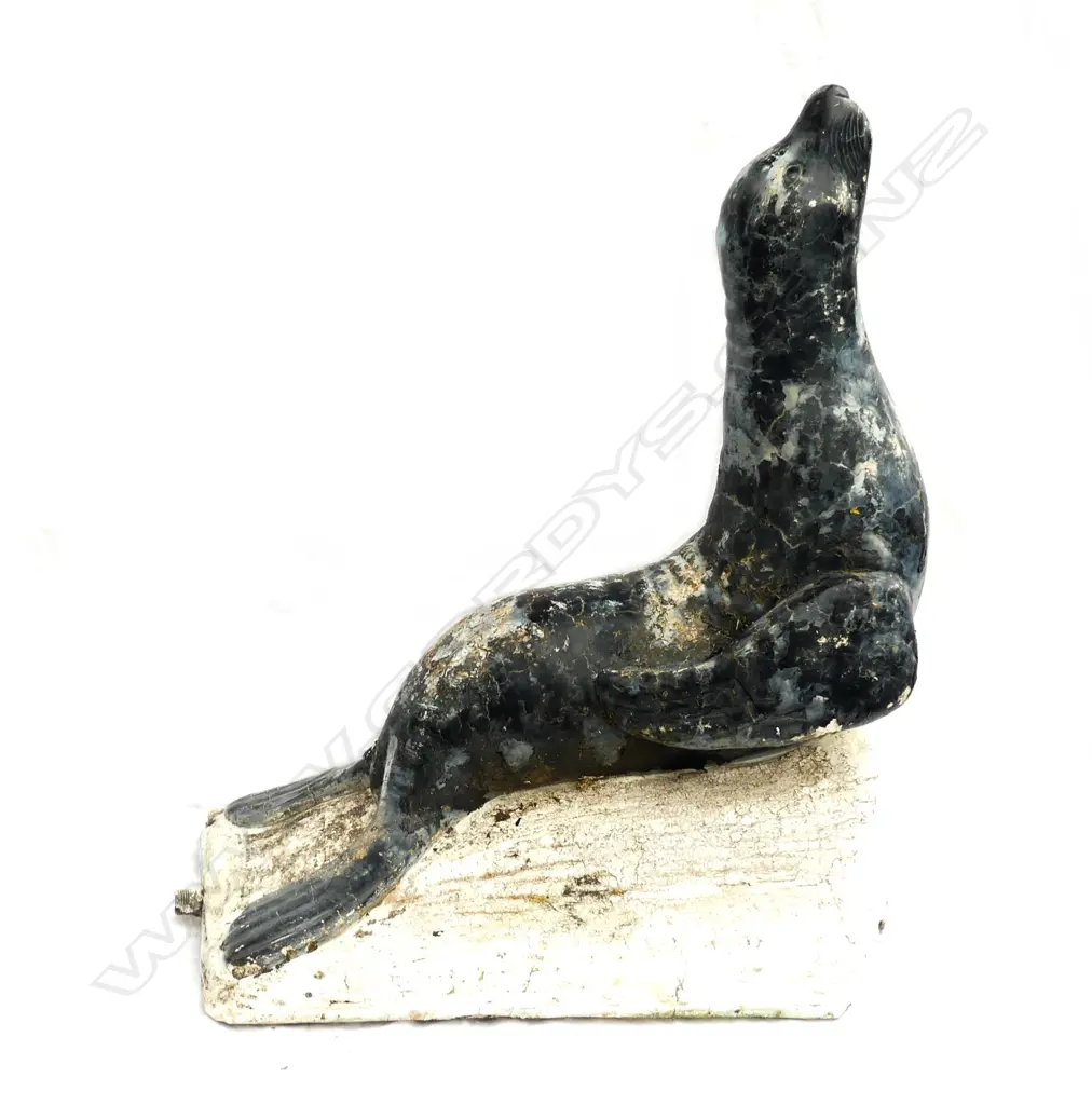 A vintage concrete garden seal Image 1++