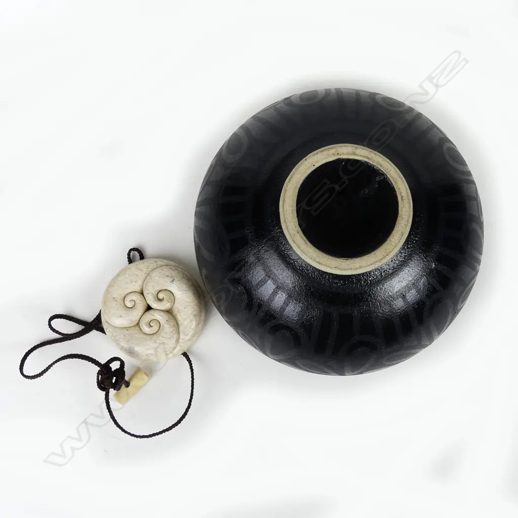 Anneke Borren and Owen Mapp black glazed pot with lid as a carved bone pendant Image 1++