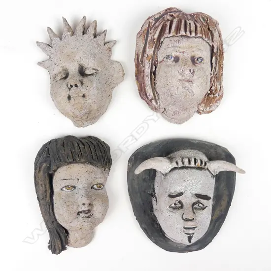 Four Helen Perrett sculpted pottery 'Family Portraits' wall masks