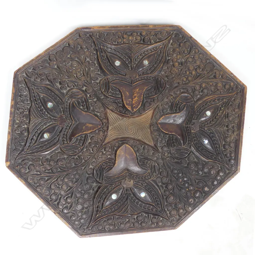 An octagonal carved tabletop Image 1++