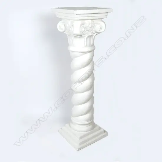 A reproduction cast plaster pedestal stand